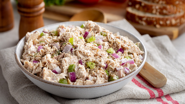 Bowl of tuna salad with chopped celery and onion