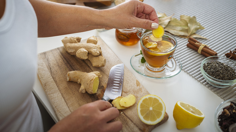 Woman cooking with ginger