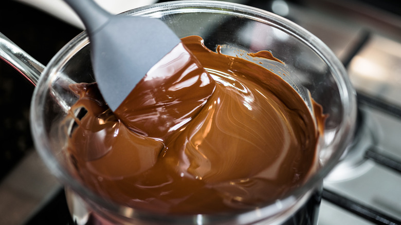 Melting chocolate in glass bowl