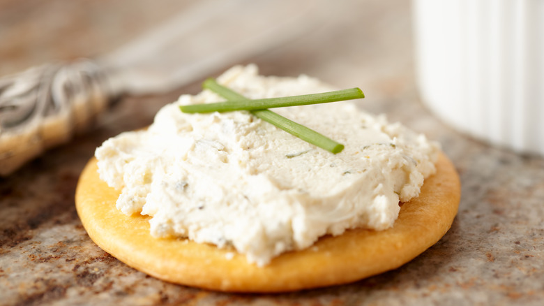 boursin cheese on a cracker