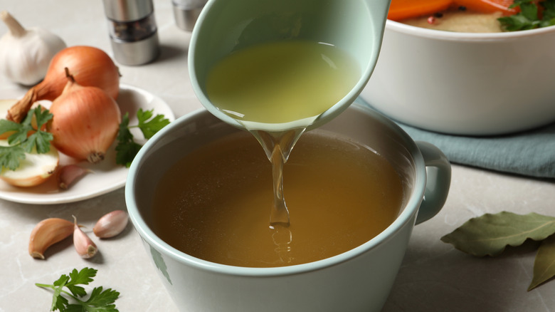 Broth being poured into bowl 