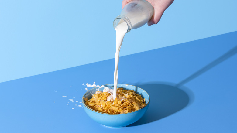 Pouring milk into cereal