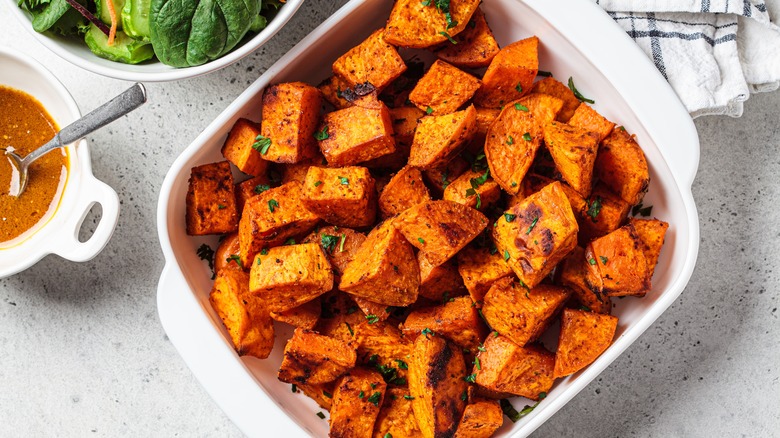 Tray of homemade crispy baked sweet potatoes