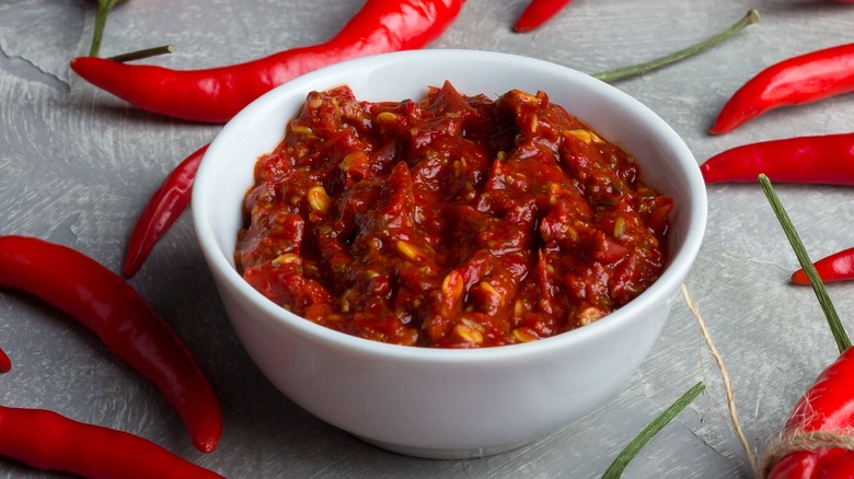 harissa in a bowl and chili peppers