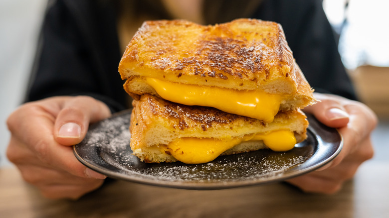 Pile of grilled cheese on plate