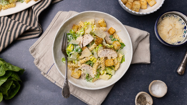 Caesar chicken pasta salad on plate with fork