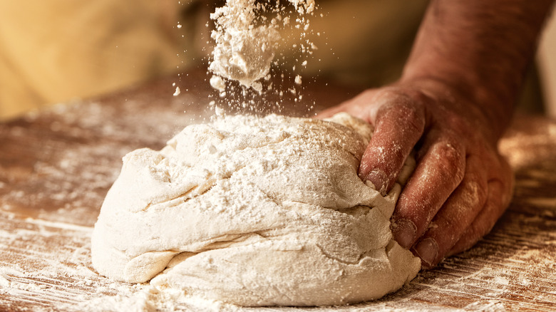 kneading bread dough