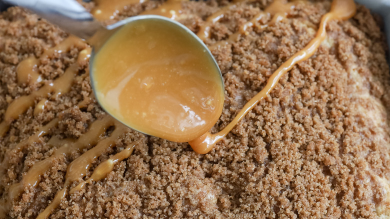 Caramel drizzled onto coffee cake