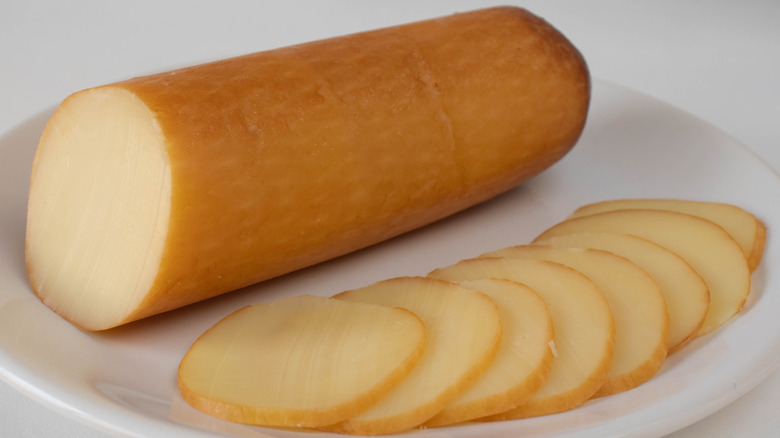 provolone cheese cylinder and slices