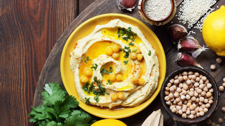 Bowl of hummus and ingredients