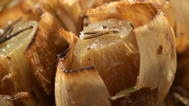 Close-up of roasted garlic bursting out of it's papery skin