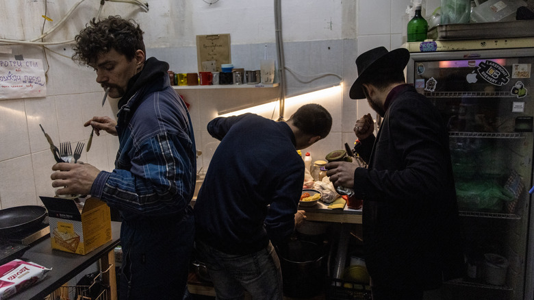 preparing dinner at a bomb shelter in Ukraine