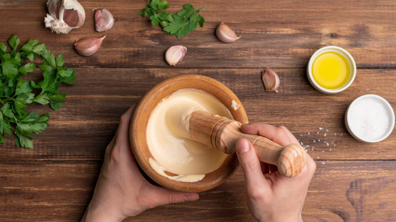 making aioli with mortar and pestle