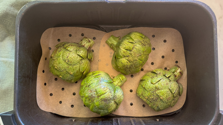 artichokes face down in fryer