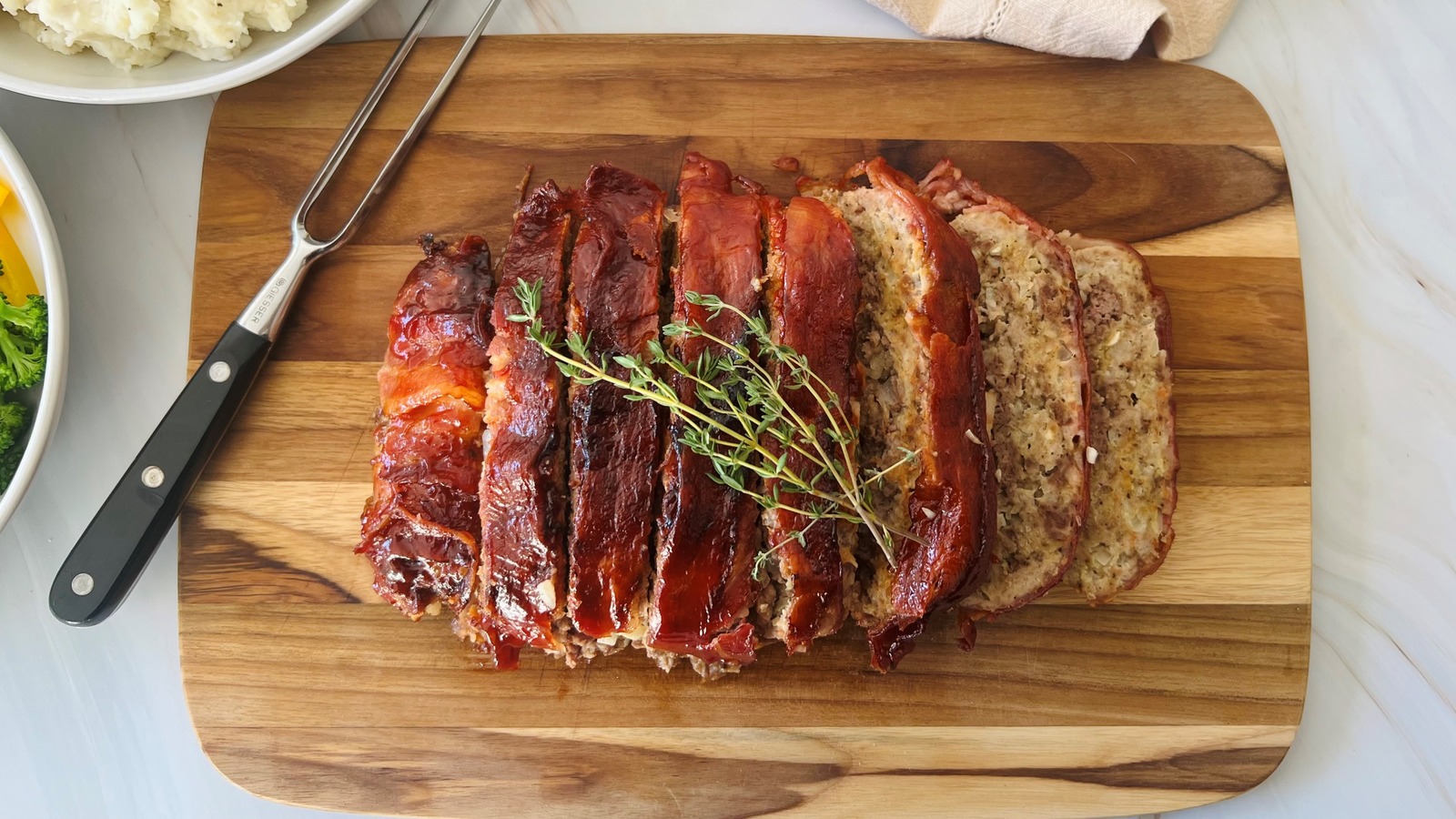 https://www.tastingtable.com/img/gallery/air-fryer-bacon-wrapped-meatloaf-recipe/l-intro-1697722527.jpg