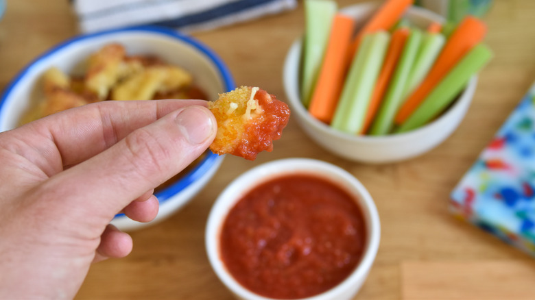 hand holding cheese curd