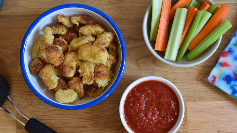 cheese curds, marinara, and veggie sticks