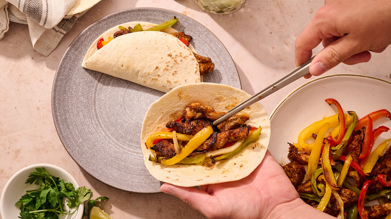 serving fajitas on tortillas