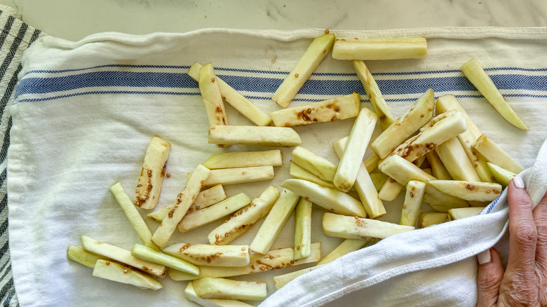 cut eggplant on dish towel