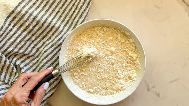 hand whisking wet batter