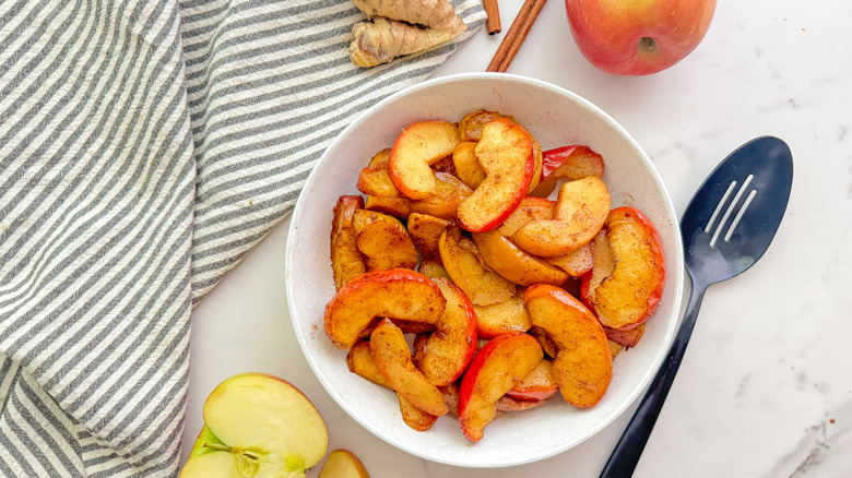 white bowl of cooked apples