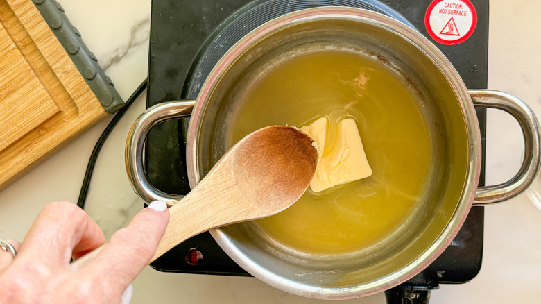 wooden spoon stirring butter