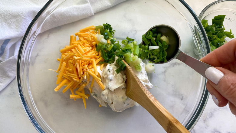 cheese and scallions in bowl