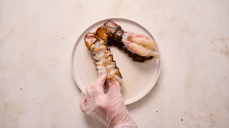 releasing lobster meat from shell