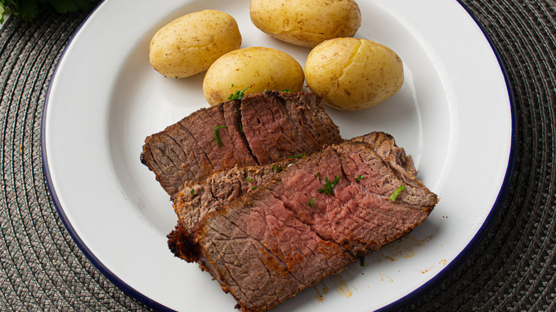 beef and potatoes on plate