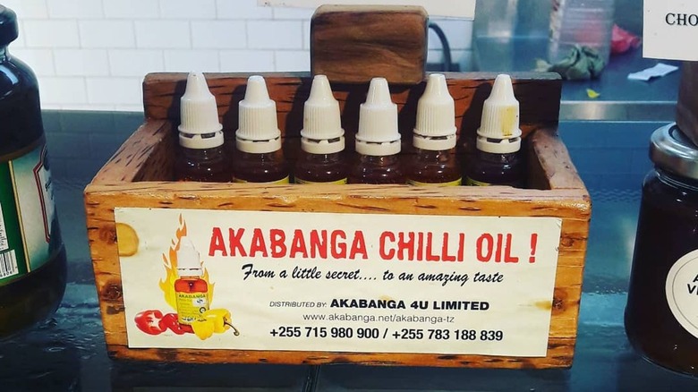 bottles of akabanga chili oil in wooden box