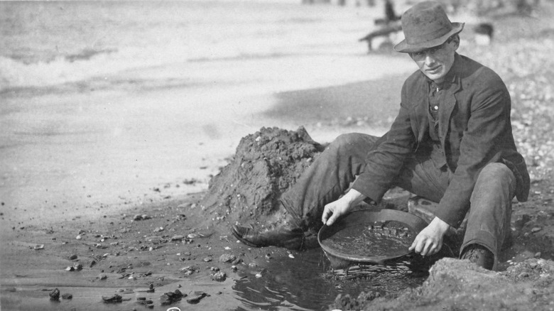 man panning gold in Alaska 