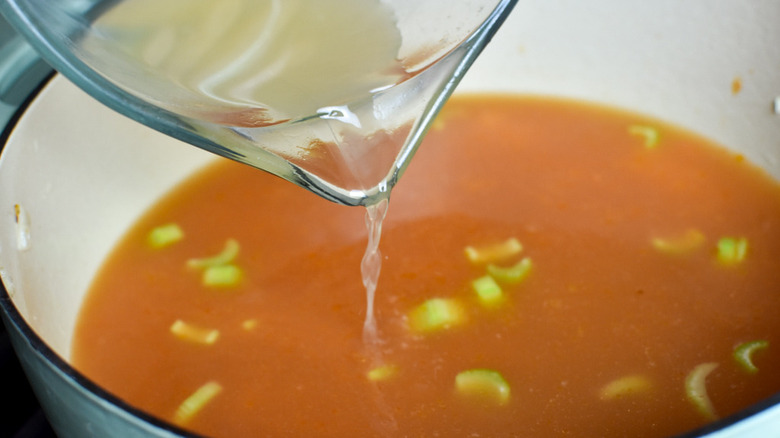 pouring stock into pot