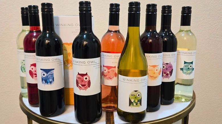 10 bottles of Aldi's Winking Owl wines lined up on a table