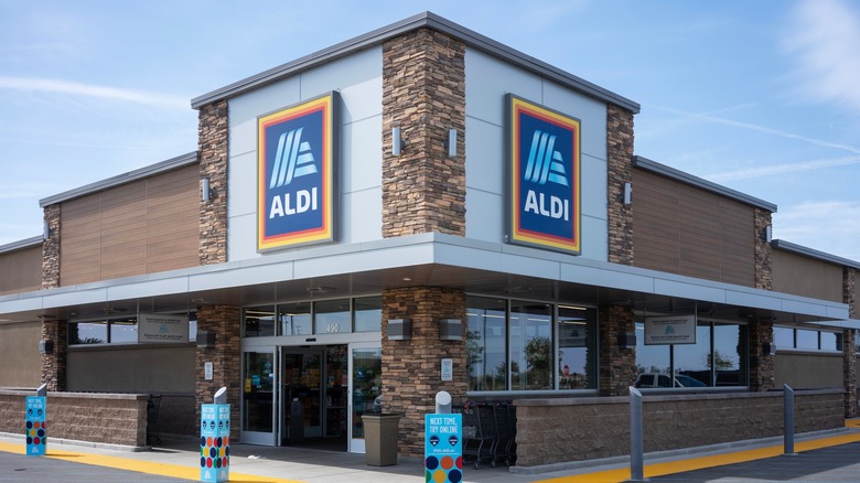 Aldi storefront with logo against blue sky