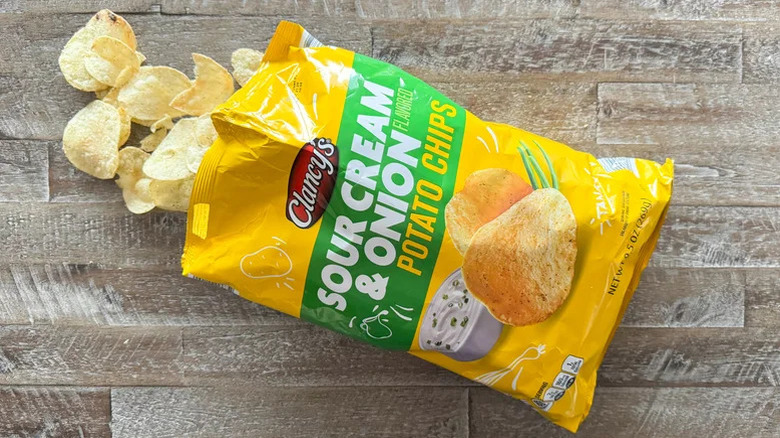 open bag of Clancys sour cream and onion potato chips