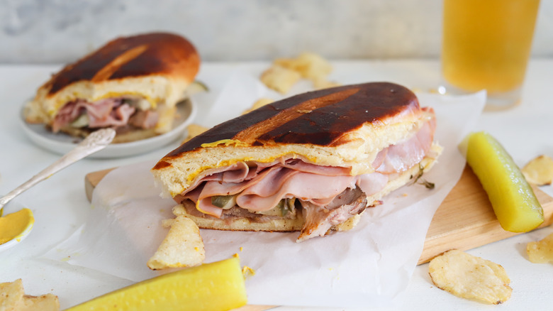 halved cuban sandwich on board
