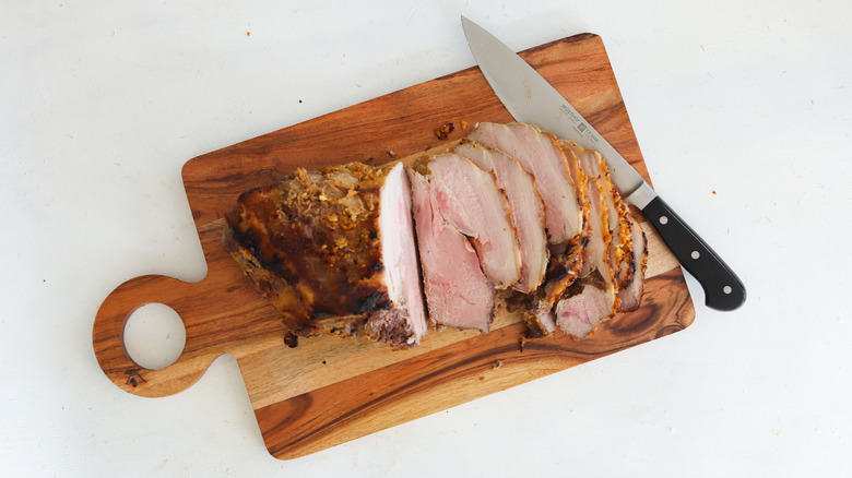 pork sliced on cutting board