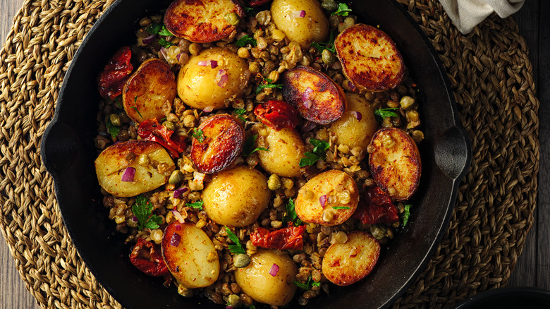 Marinated potatoes in skillet