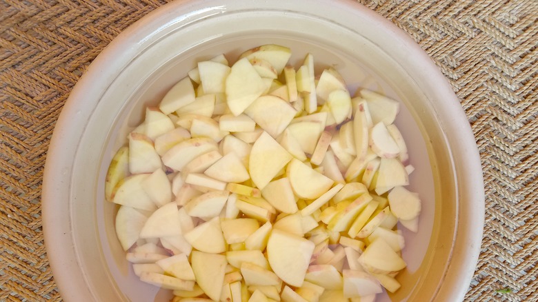 Bowl of soaking potatoes 