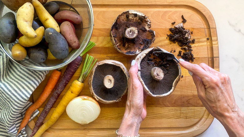 removing the gills of the mushrooms