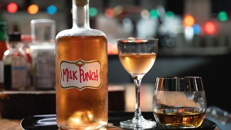 One bottle and two glasses, labeled "milk punch"