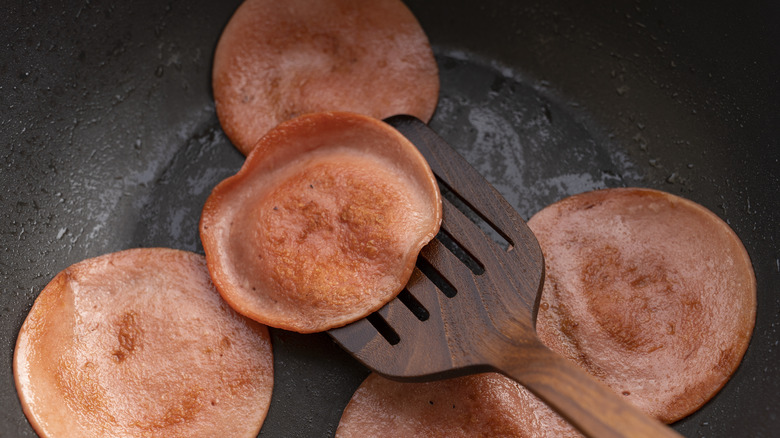 Frying bologna in pan