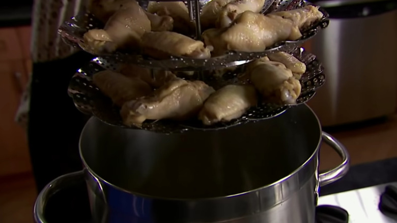 Alton Brown uses steel lotus for chicken wings
