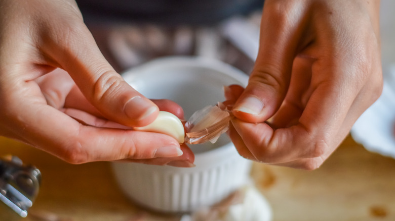 Peeling garlic with hands