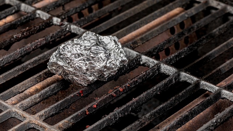 Ball of aluminum foil on grill