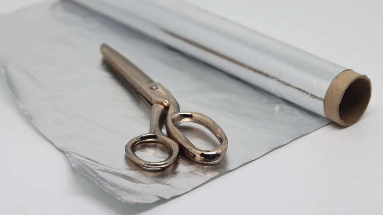 Aluminum foil with scissors