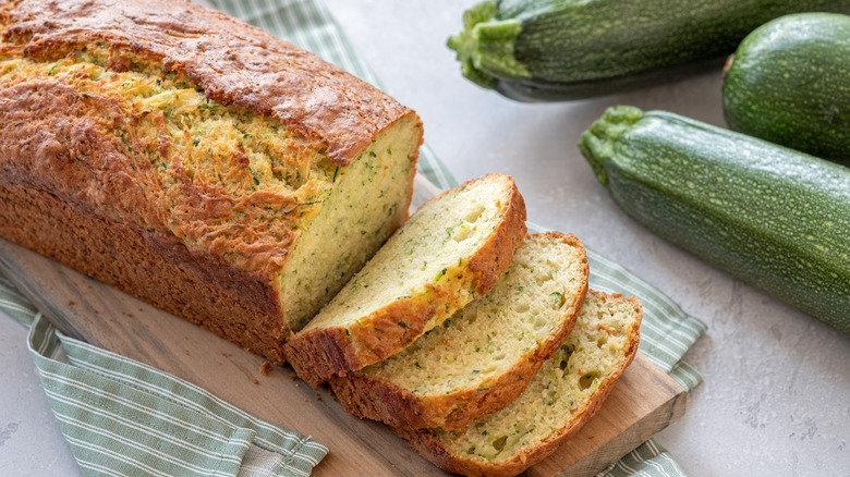 Zucchini loaf with slices and zucchinis