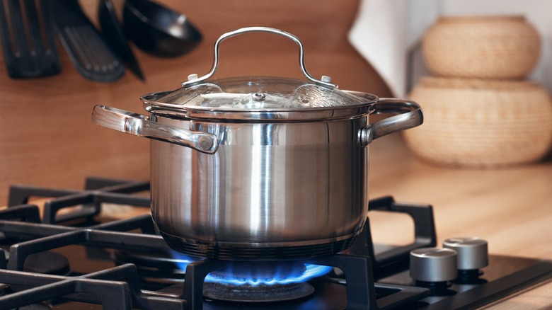 Why do people in the US use stoves to boil water instead of using