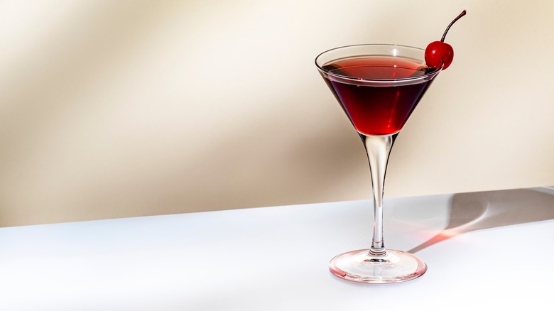 Manhattan cocktail with cherry garnish