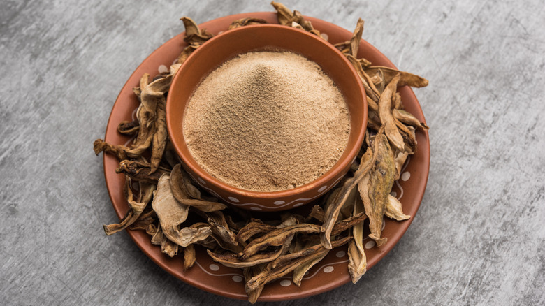 Brown amchur powder terracotta bowl dried mango